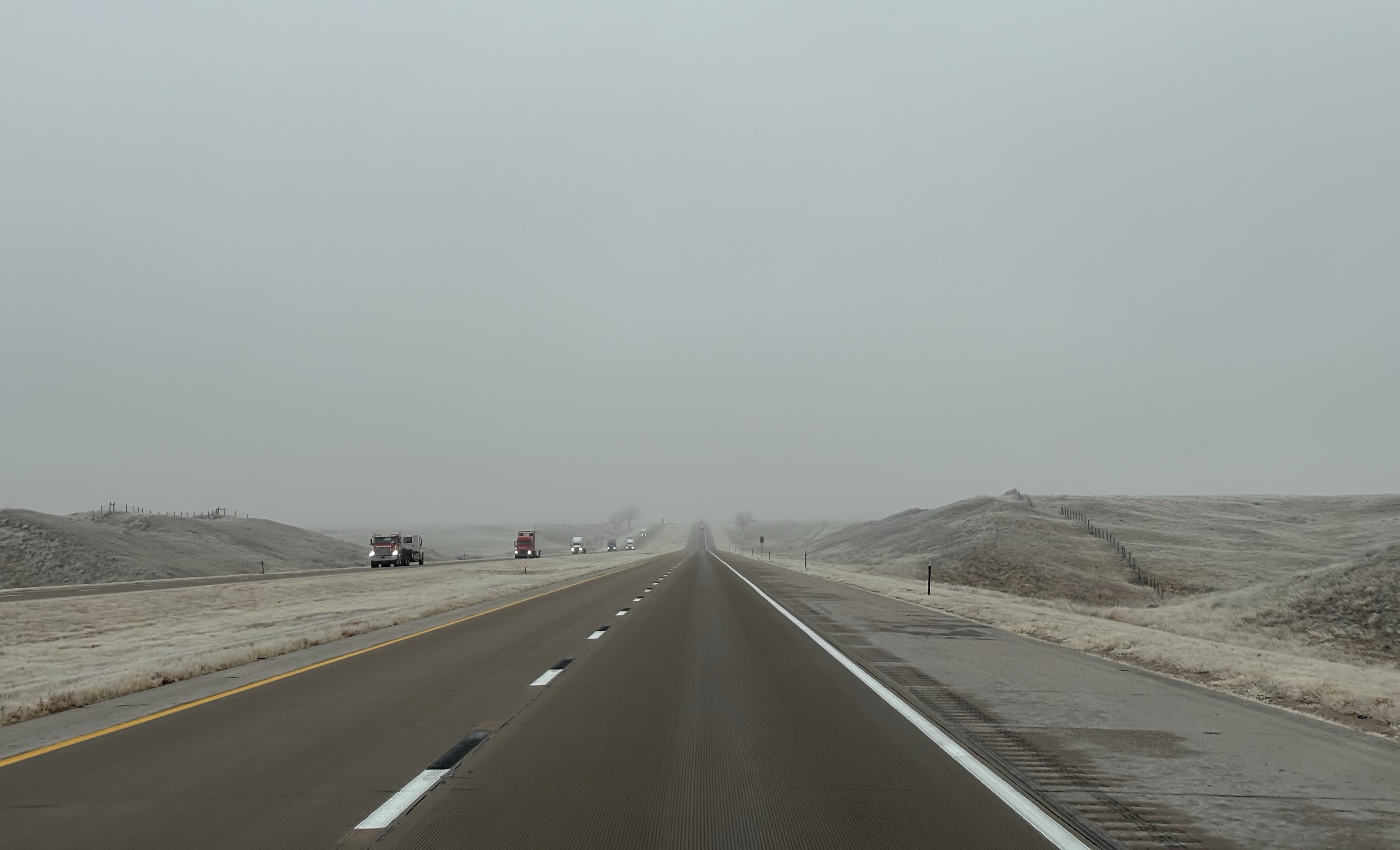 Highway, with poor visibility due to fog.